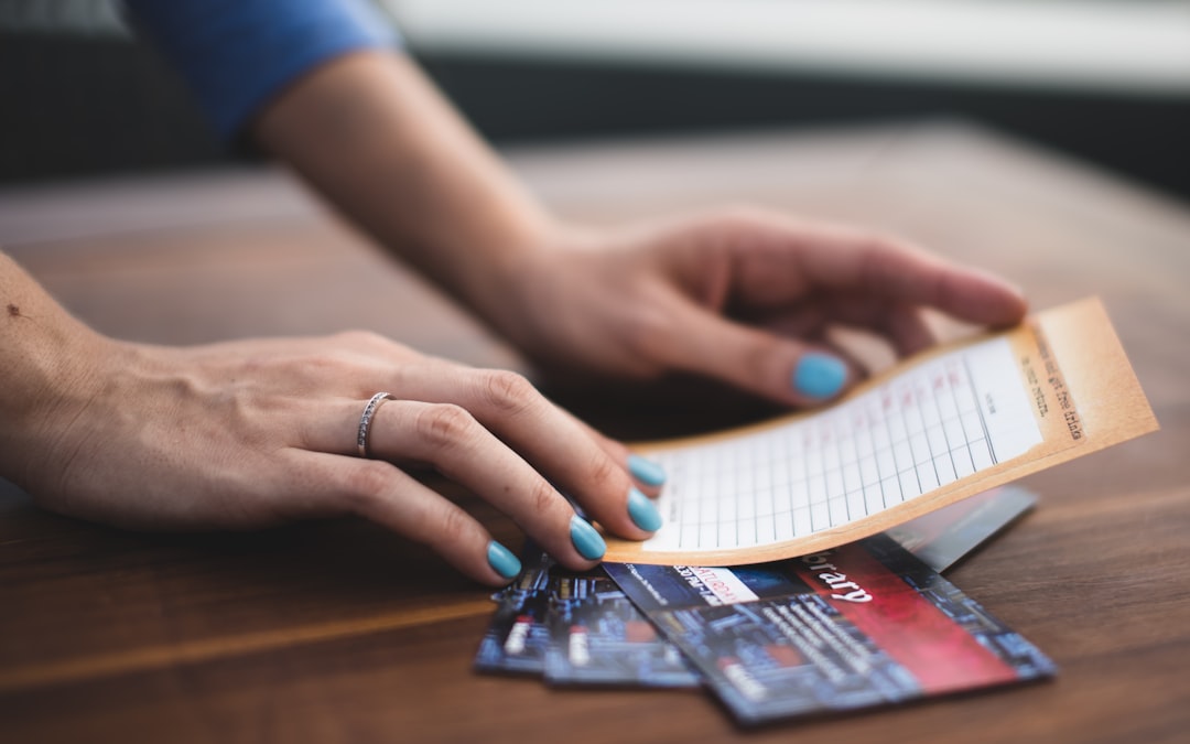 person-reading-card-on-three-tickets-em8kktlxe7s